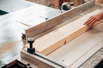 Cutting Timber on Table Saw in Woodworking Workshop