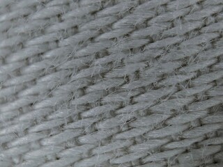 Extreme Macro Shot of Woven White Fabric Texture with Visible Fibers and Interlacing.