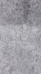 Gray textured surface with uneven mottled pattern — versatile background for design, architecture, and presentations.