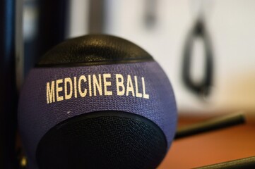 Textured Medicine Ball CloseUp Fitness Equipment in Gym Setting Health and Wellness.