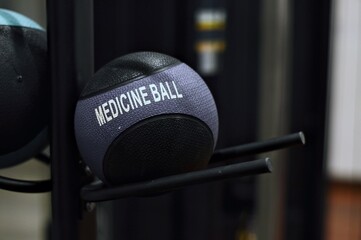 Textured Medicine Ball on Rack Gym Equipment CloseUp Fitness Training.