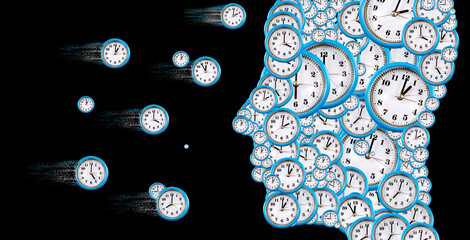 Conceptual representation of time with a face made of clocks swirling through a dark background