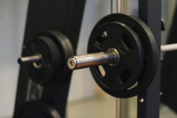 Weighted Barbell on Smith Machine Strength Training Equipment CloseUp.
