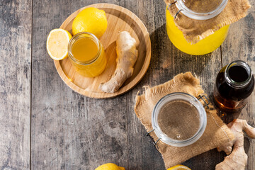 Colorful Kombucha Jars and Bottles on wooden table. Top view. Copy space