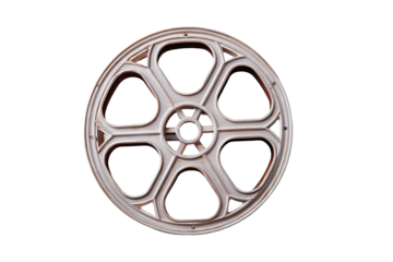 Vintage film reel.  A light beige or cream-colored film reel, circular, with a segmented design.  Each segment is arched with decorative details.  Isolated on black background
