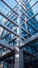Low-angle view of a modern glass and steel office building