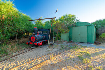  locomotive stopped in the workshop at Barril beach in the village of Pedras del Rei-Tavira-Algarve-Portugal.