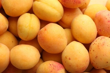 Fresh ripe sweet apricots as background, top view