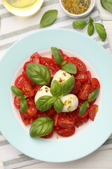 Tasty salad Caprese served on table, flat lay