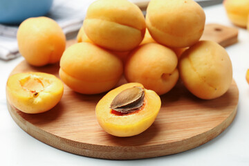 Fresh ripe apricots on white table, closeup