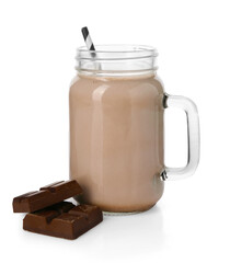 Tasty milkshake in mason jar and pieces of chocolate isolated on white
