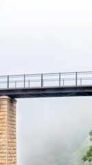 A stoic bridge emerges from a veil of mist, its robust structure and elegant railings piercing the ethereal fog, connecting two unseen worlds in a serene, atmospheric landscape.