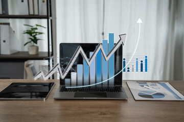 Modern workspace of an online entrepreneur with digital growth graphs overlaying a laptop screen, symbolizing business success, financial analytics, and remote work in the digital economy.