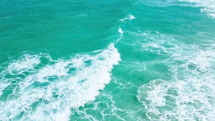 Presents a natural landscape of blue sea and white waves, conveying a fresh and tranquil ocean atmosphere.