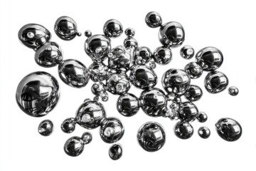 Metallic spheres scattered on white background