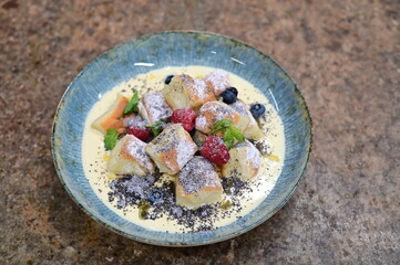 Traditional Czech Vanilla Buchticky with Sweet Milk Sauce, Fruit and Poppy Seeds