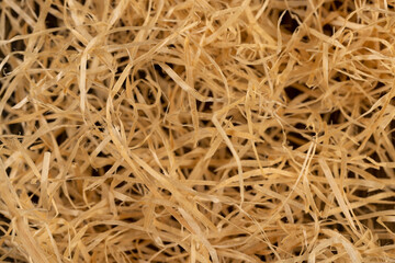 yellow sawdust for creativity close up, natural sawdust from wood and for decorative and creative work of artisans or gift wrapping