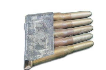 Collection of tarnished metallic bullets arranged in a holder