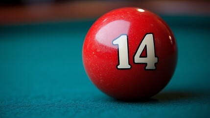 Close-up of a pool ball numbered fourteen.