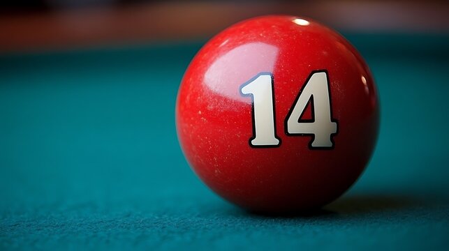 Close-up of a pool ball numbered fourteen.