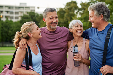 Senior group of happy men and smiling women relax after workout
