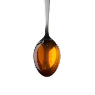 A single silver metallic tablespoon filled with viscous, translucent, rich amber Asian fish sauce, with a slight sheen, centrally on a blurred transparent background. Product photography concept.