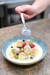 Traditional Czech dessert, sweet baked buns with vanilla cream