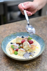 Traditional Czech dessert, sweet baked buns with vanilla cream