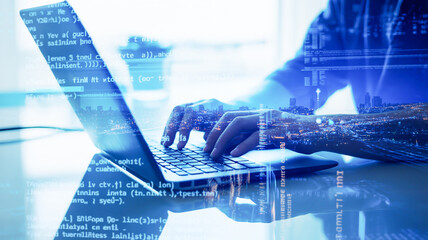 A digital composite image of hands typing on a laptop keyboard overlaid on a holographic cityscape background.