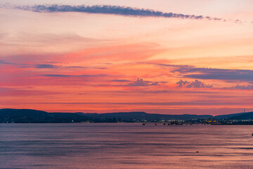 colorful sunset over the port of Novorossiysk on a summer evening