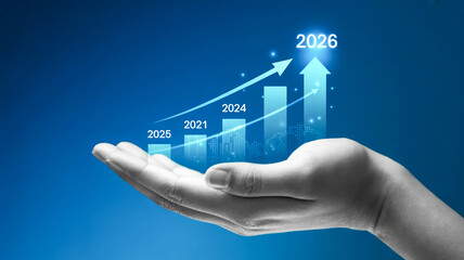 A digital visualization of a hand holding a holographic display showing a financial growth chart