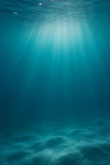 Sunlight Streaming Through Clear Blue Ocean Water onto Sandy Seabed