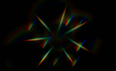 light flares in prismatic rainbow colors on black background