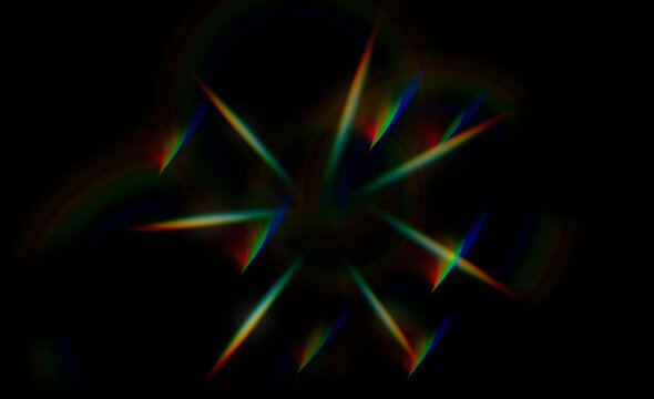 light flares in prismatic rainbow colors on black background