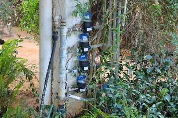 Water meter and hose for water supply system in the garden. Water supply system.