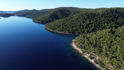 Obraz premium Dugi Otok's rugged stone coast stuns with raw Adriatic beauty—dramatic cliffs, crystal-clear waters, and golden light perfect for breathtaking, timeless photography.