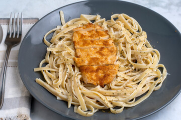 fettuccine  alfredo  with seasoned chicken breast
