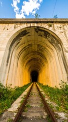 Tunnel archway with railway tracks