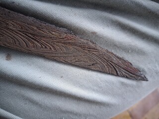 An old, rusty knife blade that is hundreds of years old, this knife is a typical weapon of the Bugis tribe of Sulawesi. 