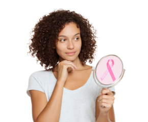 Thoughtful woman looks at a pink ribbon in a mirror, breast cancer awareness.