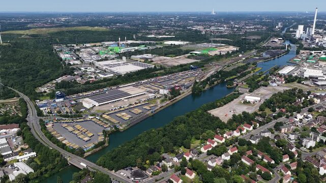 view of Logistical companies along the Rhine Herne canal with industrial buildings and vegetations