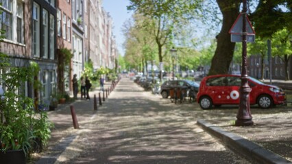 Urban street in amsterdam with blurred buildings and cars featuring people walking among greenery and historic architecture on a sunny day with trees lining the sidewalk.