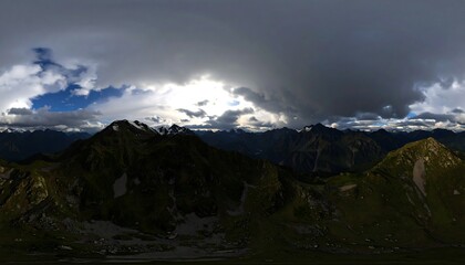 Fototapeta premium Majestic mountain peaks shrouded in dramatic storm clouds panoramic landscape