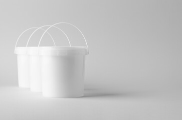 Plastic paint or food bucket tub container mockup on neutral background © Shablon