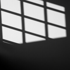 Grid Window Shadow Forming Geometric Pattern