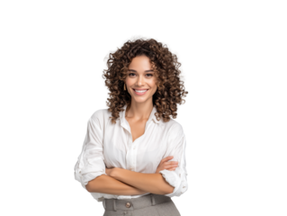 Confident young businesswoman with beautiful curly hair smiling warmly at the camera, standing with arms crossed in a professional white shirt, isolated on a white background for corporate use.