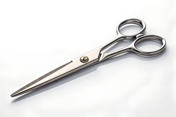 Obraz premium Silver metal scissors on a bright surface, sharp cutting tool