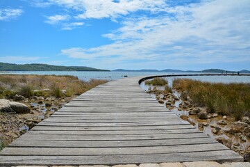 boardwalk to the beach, wooden walkway on the sea