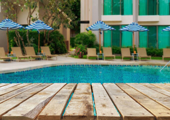 Wooden table top on the beach or sea. swimming pool Party on the beach  sunshine time concept.For montage product display or design key visual layout.View of copy space.