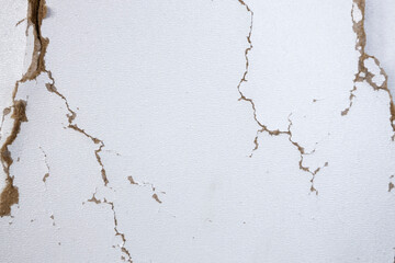 White background with cracks. Torn cracks on the texture. Textured space for design